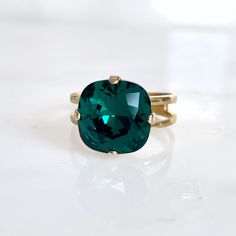 Emerald green crystal ring This vibrant crystal cocktail ring makes quite a statement. I have hand set a large 12mm square cushion cut Swarovski crystal into a plated adjustable ring (about size 5 at the smallest and be larger from there). The nearly 7-carat crystal is perfect for a special occasion or everyday bling. The shade is a rich emerald green. Ring base is Nickel Free Copyright ©, all rights reserved - www.LoveYourBling.com www.LoveYourBling.com LoveYourBling® is an authorized SWAROVSKI Green Crystal Ring, Emerald Green Ring, Emerald Green Crystal, Green Crystal, Crystal Ring, Green Crystals, Crystal Rings, Pink Crystal, Adjustable Ring