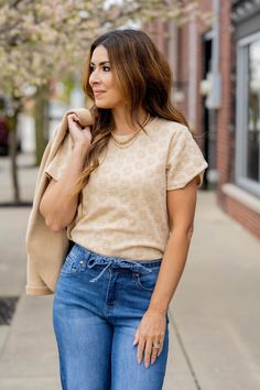 This tee is one-of-a-kind! With the addition of the unique textured flowers this is sure to have you turning heads. Pair with shorts or a skirt in the warmer months or layer with a blazer, cardigan, or jacket in the cooler ones!95% Polyester & 5% Spandex Chic Knit T-shirt For Spring, Casual Jacquard Knit Top For Spring, Spring Jacquard Knit Crew Neck Top, Spring Textured Knit Casual Top, Spring Textured Knit Top For Day Out, Textured Knit Tops For Spring Day Out, Summer Casual Jacquard Knit Tops, Casual Jacquard Knit Top, Casual Jacquard Knit Tops For Summer