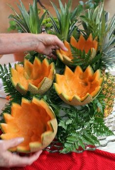 pineapples and other fruits are arranged on a table