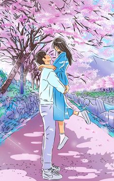 a man and woman walking down a sidewalk under a tree filled with pink flowers