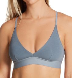 This breathable bralette is wire-free to keep you comfortable all-day. The adjustable straps attach at center back with a J-hook to form racerback. Made of organic Pima cotton and spandex. Wireless triangle cups are unpadded and have soft knit lining. Cups have vertical darts to keep breasts centered. Exposed elastic underband circles to back. V-neckline shows off your cleavage. Covered elastic along the neckline provides a flexible fit. Tall sides and back have finished side seams, encased elas Everyday Bra With Adjustable Straps, Casual Everyday Sports Bra With Adjustable Straps, Everyday Solid Bra With Adjustable Straps, Everyday Sports Bra With Tank Straps, Adjustable Straps Strappy Back Sports Bra, Triangle Bra, Pima Cotton, Soft Knits, Pullover Styling