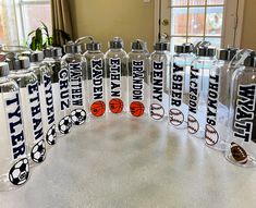 six sports water bottles with the names of each team and their respective logos on them