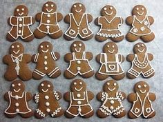 gingerbread cookies decorated with white icing and decorations