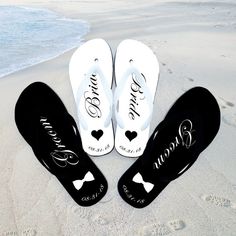 three pairs of personalized flip flops on the beach