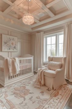 a baby's room with a crib, rocking chair and chandelier