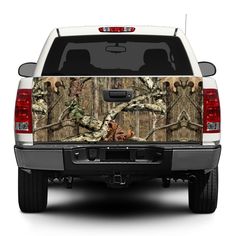 the back end of a white truck with camo