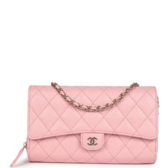 This Chanel Wallet on Chain is in pink caviar with light gold tone hardware and has a front flap with a textured CC emblem, and a removable long light gold tone metal and pink leather chain.The interior is lined in pink leather and grosgrain fabric and features a top zipper pocket under flap, a slit front pocket, a zipper compartment with leather pull, and an open pocket with six credit card slots.Collection: 31-Series (2021)Origin: SpainCondition: New and never (plastic on hardware)Accompanied by: Chanel box, Chanel dustbag, COA card, ribbon, carebook, removable chain strapMeasurements: 7.75" width x 5" height x 1.5" depth; 21" strap drop Chanel Wallet On Chain, Chanel Box, Louis Vuitton Shop, Long Light, Wallet On Chain, Birkin 25, Celine Bags, Chanel Wallet, Leather Pulls