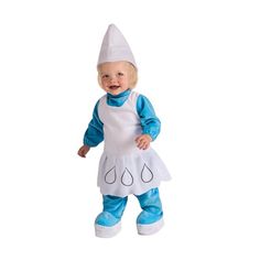 a baby doll dressed in an apron and hat is standing on one leg, smiling at the camera