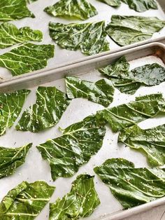 two pans filled with green leafy vegetables