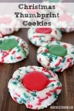 christmas thumbprint cookies on a wooden table