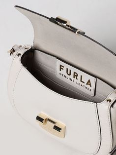 Find FURLA Mini Bag on Editorialist. The Furla mini bag features a turn lock closure. It can be worn on the shoulder or crossbody. Luxury White Bag With Turn-lock Closure, Luxury White Bags With Turn-lock Closure, Timeless White Bag With Turn-lock Closure, Luxury White Shoulder Bag With Turn-lock Closure, Designer White Shoulder Bag With Turn-lock Closure, Luxury Flap Bag With Metal Hardware For Everyday, White Crossbody Bag With Turn-lock Closure, White Top Handle Shoulder Bag With Turn-lock Closure, Elegant White Bag With Turn-lock Closure