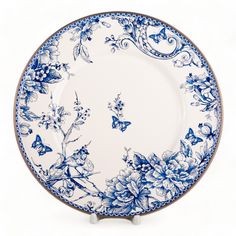 a blue and white plate with flowers on it