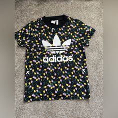 Black, Adult Xs, Never Worn Black Floral Print Casual T-shirt, Casual Streetwear Floral Print Tops, Casual Floral Print Tops For Streetwear, Black Floral Cotton Top, Trendy Adidas T-shirt For Spring, Black Floral Print Short Sleeve Tops, Adidas Multicolor Graphic Print T-shirt, Adidas Multicolor Graphic Print Tops, Adidas Multicolor Casual Tops