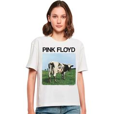 a woman wearing a pink floyd t - shirt standing in front of a white background