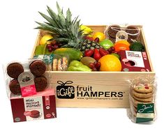 a wooden box filled with assorted fruit and snacks