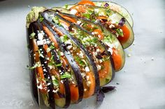 sliced up vegetables sitting on top of a cutting board