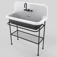 a white sink sitting on top of a metal stand