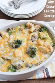 a casserole dish with broccoli, mushrooms and cheese in it on a table