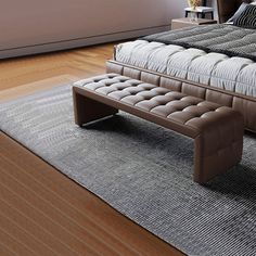 a bed sitting on top of a wooden floor next to a window