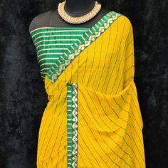 Product Detail - yellow colored casual wear saree is made from moss georgette fabric which is highlighted with beautiful stripes printed work with lace border as shown. Comes along unstitched heavy gota blouse piece which you can customise as per your design/style. Occasion - You can wear this saree for casual, outings, social meets and other homely events. Style it up - Look glamorous in this traditional saree by (HELUM FAB) Pair this saree with beautiful clutch to complete the look!! Measureme Yellow Georgette Pre-draped Saree With Pallu, Bollywood Style Yellow Pre-draped Saree For Navratri, Yellow Bollywood Pre-draped Saree For Navratri, Yellow Unstitched Georgette Blouse Piece, Yellow Georgette Saree With Unstitched Blouse, Yellow Bollywood Style Pre-draped Saree In Georgette, Bollywood Style Yellow Pre-draped Saree With Unstitched Blouse, Yellow Bollywood Pre-draped Saree With Unstitched Blouse, Yellow Bollywood Pre-draped Georgette Saree