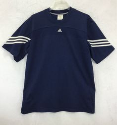 Thank-You SO MUCH For Supporting Small Business =) Adidas / Short Sleeve Athletic Shirt Vintage Vintage Y2K (03/2004) / Striped Sewn on Sleeve Fabric: 100% Polyester "Pit to Pit" Across Front is About 23" / Length of Back is About 30" Color: Navy Blue / White Men's Size: L Sometimes Washing an Item Will Slightly Change The Size, Since This is Preowned, (Please Compare Actual Measurements Above to Those of Your Current Favorite Similar Style Athletic Shirt, To Ensure a Great Fit) Item #: D25-14 T Y2k Shirts Men, Y2k Shirts, Adidas Short, Y2k Adidas, Blue Y2k, Style Athletic, Adidas Blue, Color Fashion, Athletic Shirts