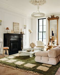 a living room filled with furniture and a fire place