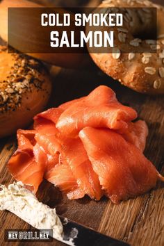 salmon on a cutting board with bagels in the background and text overlay that reads cold smoked salmon