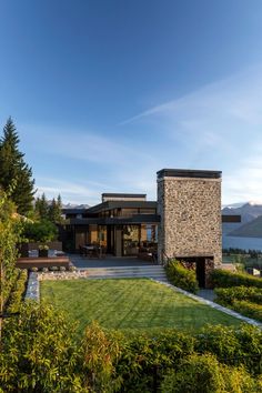 the house is surrounded by greenery and trees