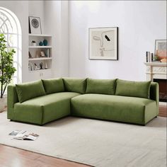 a living room with a large green sectional couch