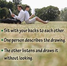 two people sitting in the grass with their backs to each other