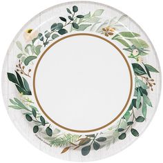 a white plate with green leaves and flowers on the rim, along with a gold border