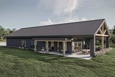 a house with a covered patio in the grass