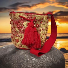 anabella medium crochet crossbody with crystals, lace, and pearls Designer Bucket Bag As Gift, Luxury Bucket Shoulder Bag As Gift, Luxury Bucket Shaped Shoulder Bag As A Gift, Luxury Bucket Shoulder Bag Suitable For Gifts, Luxury Bucket Shoulder Bag Perfect For Gifting, Traditional Bucket Shoulder Bag As Gift, Designer Red Embroidered Bag, Traditional Gold Shoulder Bag For Travel, Luxury Handwoven Bucket Bag For Travel