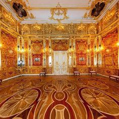 an ornately decorated room with gold and red accents