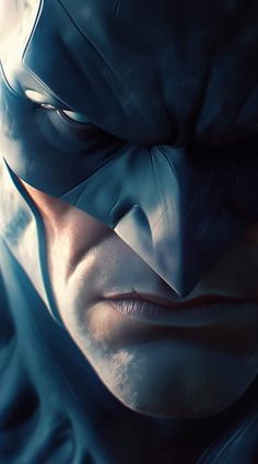 a close up of a person wearing a batman mask