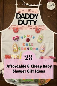 a white apron with the words daddy duty on it and other items in front of it