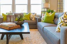 a living room filled with furniture and pillows