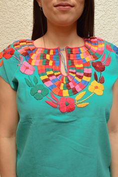 Magia Mexica Mexican Embroidered Blouses Women Blouse multicolored handmade by Mexican artisans. Measurements: ↕ 23 in ↔ 20 in WARRANTY We use what is needed to make your item arrives 100% safe and intact to your address. SHIPPING & DELIVERY TIMEFRAME We ship your order within 1-2 days after purchase USA: *Free Shipping USA 15-20 business days *Standard: 1 week * Express: 3 days Rest of the World: *Standard 4-6 weeks * Express: 5 days Every order is shipped within 1 business day Including IN Artisan Embroidered Summer Top, Artisan Embroidered Tops For Summer, Green Folk Style Embroidered Top With Floral Embroidery, Folk Style Green Embroidered Top With Floral Embroidery, Folk Style Green Embroidered Top, Folk Style Multicolor Top With Geometric Embroidery, Artisan Multicolor Cotton Top, Multicolor Embroidered Tops For Cinco De Mayo Fiesta, Multicolor Cotton Tops For Cinco De Mayo