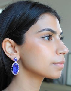 Handmade Material: Platinum Plated, Lab Simulated Purple and White Sapphire Stones Size: Earrings measure 2 inches long Imported Item Number: 7039 Sapphire Stones, Halo Earrings, Sapphire Stone, Purple And White, White Sapphire, Item Number, Ring Earrings, Diamond Jewelry, Halo