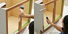 a woman is using a paint brush to paint the back of a wooden cabinet door