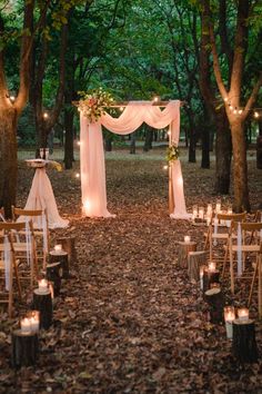 an outdoor wedding set up in the woods