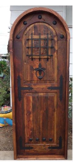 an old wooden door in front of a house