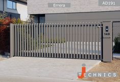 an image of a gate that has been installed in front of a building with the words technics on it