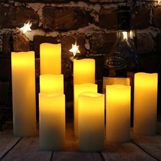 lit candles sitting on top of a wooden table