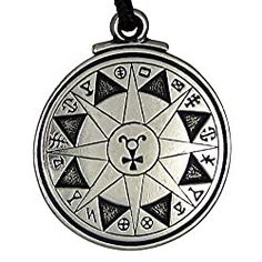 a pendant with an image of a compass on it's front and back side