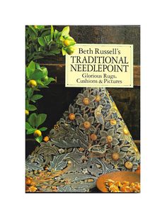 a book cover with an image of a tree and some oranges on the table