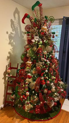 a decorated christmas tree with candy canes and ornaments