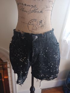 Gitano Black Distressed Cut Off Jean Shorts with bleach spots 5 inch inseam (12.70cm) 14 inch long (35.56 cm) 16 inch waist (40.64cm) Tag is Worn Size 16-18 Fitted Distressed Acid Wash Bottoms, High Rise Summer Bottoms With Holes, High Rise Fitted Grunge Shorts, Fitted High-rise Grunge Shorts, Grunge High Rise Fitted Shorts, Distressed Fitted High-waisted Shorts, Distressed High-waisted Shorts, Distressed High Waist Fitted Shorts, Distressed Fitted Short Bottoms