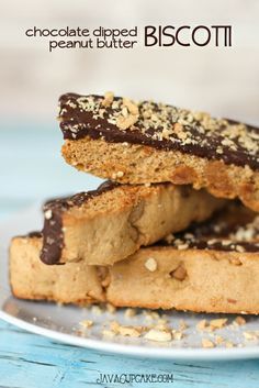 three pieces of chocolate dipped biscotti on a plate