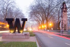 the word w is lit up in front of a street